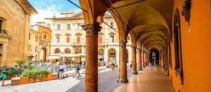 A scenic view of Bologna, Italy, showcasing historic architecture and vibrant streets during a leisurely city walk.